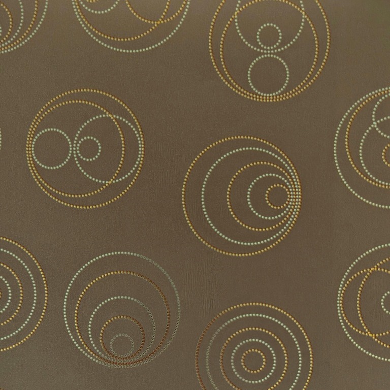 Geschenkpapierspiegel mit glänzenden Punkten in Kreisform auf mattem Taupe-Hintergrund.
 
